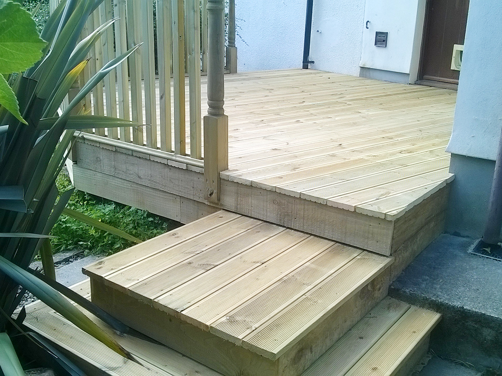 Decking area from back door with step down to garden