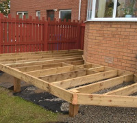During build of garden decking beside conservatory