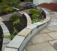 Curved slate walling with planters