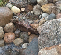 Stone waterfall with pebbles