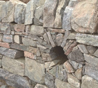 hole created in Natural stone wall
